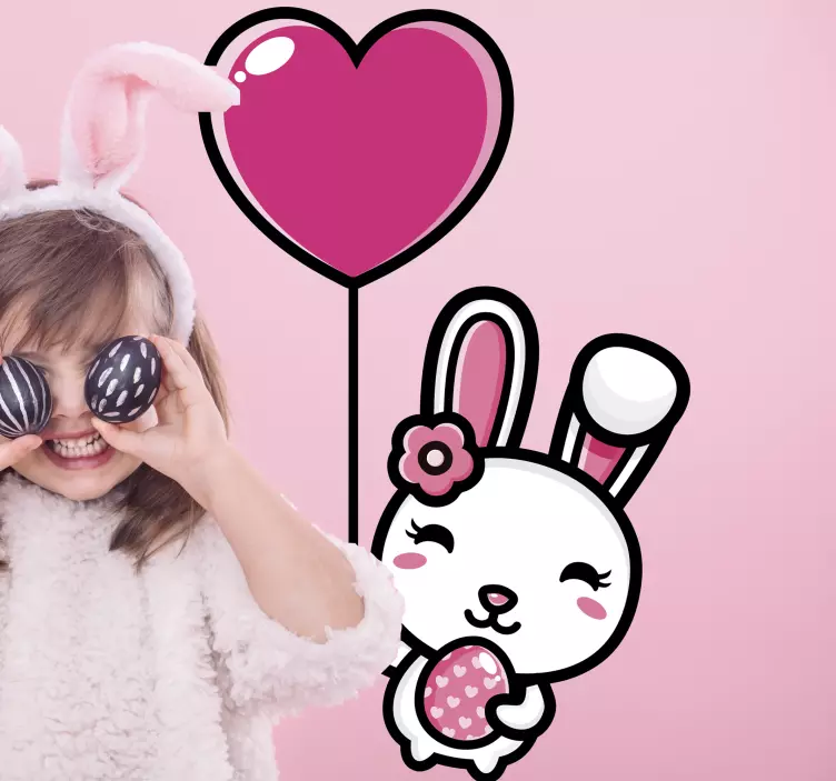 Vinilo mascota conejo feliz sosteniendo globo - TenVinilo