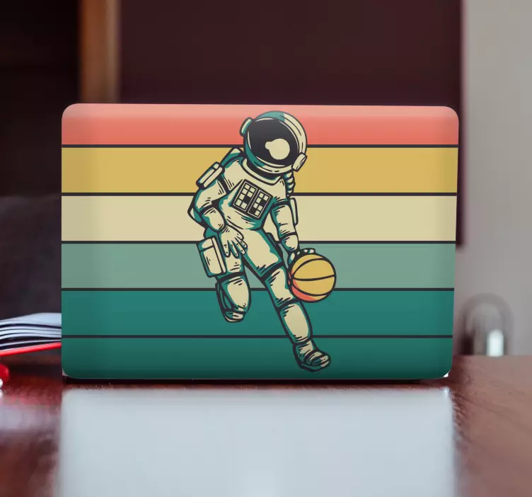 Vinilo para portátil astronauta jugando a la pelota - TenVinilo