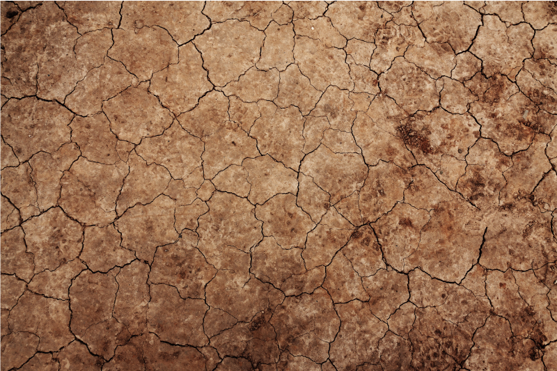 Alfombra vinílica textura piedra tierra agrietada - TenVinilo